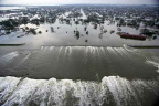 New Orleans: Broken levee because of water pressure
              and influing water after hurricane "Katrina".