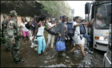 New Orleans: Evacuation from the
                          Superdome in buses under water.