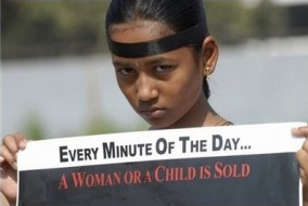 Demonstrator: 1 minute - 1 woman or child is sold
                on the world