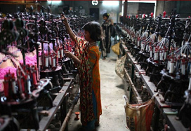 Bangladesh, girl working in a garment factory
                      in Dhaka