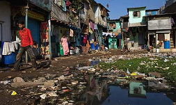 Mumbai, slum Dharavi with houses
              and trash