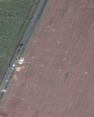 Air photo of
              the fire place of Grabovo and of a neighbored wheatfield
              with trails for putting objects