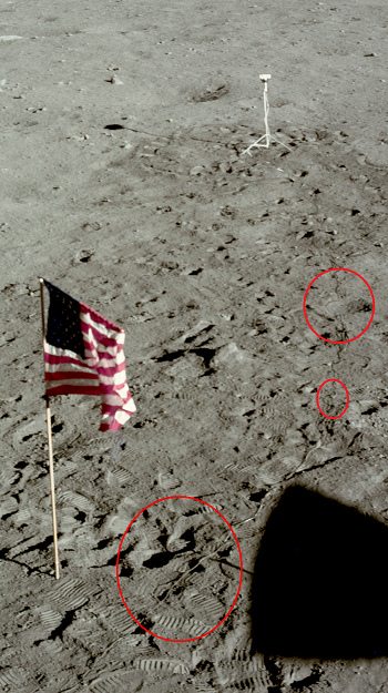 Apolo 11, foto de la NASA no. AS11-37-5480:
                        primer plano del cable de la c�mara con sombra
                        dentada, con sombras grises y con la
                        interrupci�n del cable