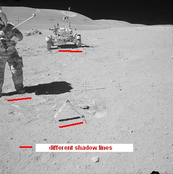 Apollo 16, photo no. AS16-106-17409:
                            Astronaut John Young has soils samples in
                            his hand, in the background the "moon
                            car".