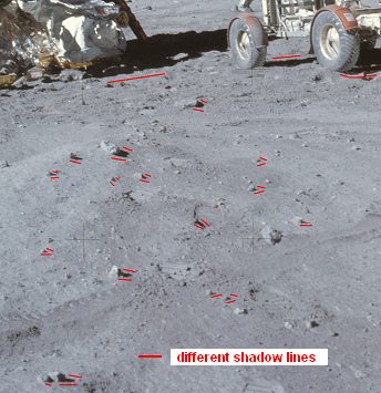 Apollo 16, photo no. AS16-107-17436:
                              The "moon car" at the
                              "lunar module" without wheel
                              tracks, study of shadows of the chaos of
                              shadows, close-up.