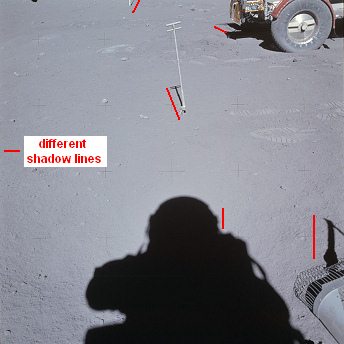 Apollo 16, photo no. AS16-106-17530:
                          Astronaut Duke with sun sensors and moon car,
                          and chaos of shadows.