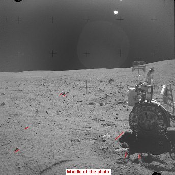 Apollo 16, photo no. AS16-108-17727:
                            "moon car" in the stony desert,
                            and chaos of shadows, and shapeless
                            "sun" on the "moon
                            sky".