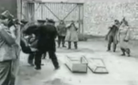 Murdered prisoner is put into a
                              coffin 01 (25min. 34sec.)