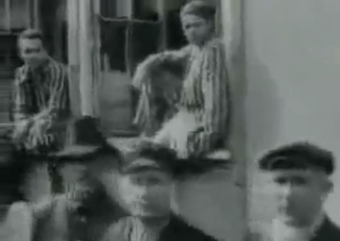 Detainees in the concentration camp of
                        Dachau 01 sitting in the window (30min. 30sec.)